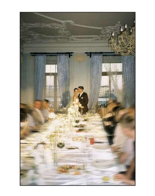 A wedding dinner in a blue room