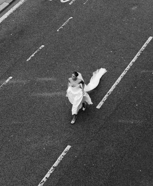 A bride crossing a New York street, photographed from above